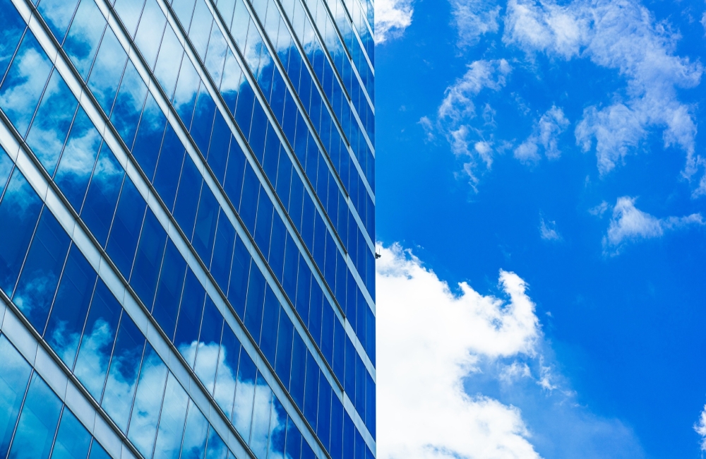 underside panoramic and perspective view to steel blue glass high rise building skyscrapers, business concept of successful industrial architecture